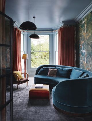 Image may contain Furniture Living Room Indoors Room and Couch