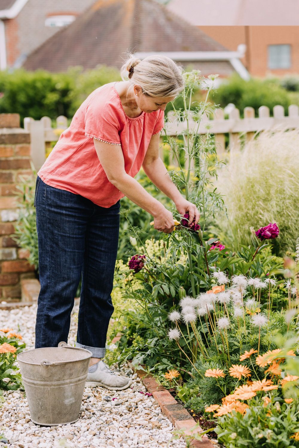 Image may contain Human Person Outdoors Garden Footwear Clothing Shoe Apparel Gardener Worker and Gardening
