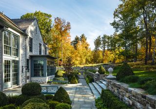 Image may contain Neighborhood Bench Furniture Grass Plant Nature Outdoors Scenery Path Lamp Walkway and Backyard