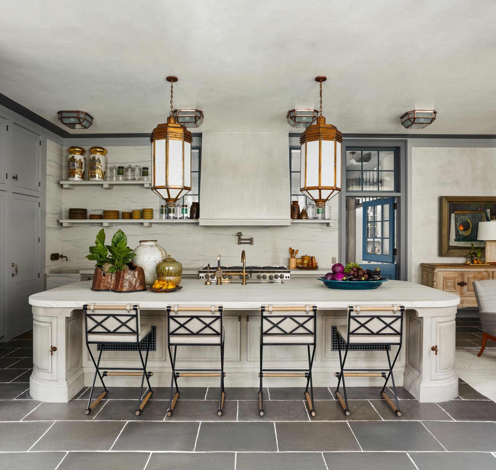 Image may contain Indoors Kitchen Kitchen Island Interior Design Architecture Building Dining Room and Dining Table