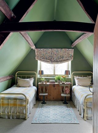 Image may contain Indoors Room Bedroom Building Housing Dorm Room Furniture Bed and Rug